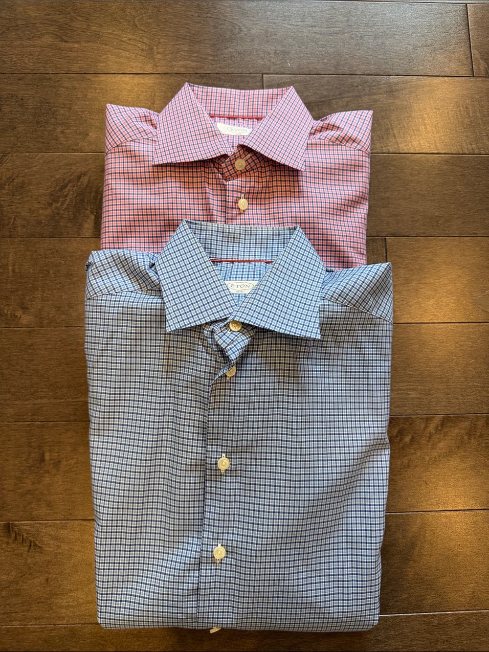 Two Eton blue grid and pink grid dress shirts
